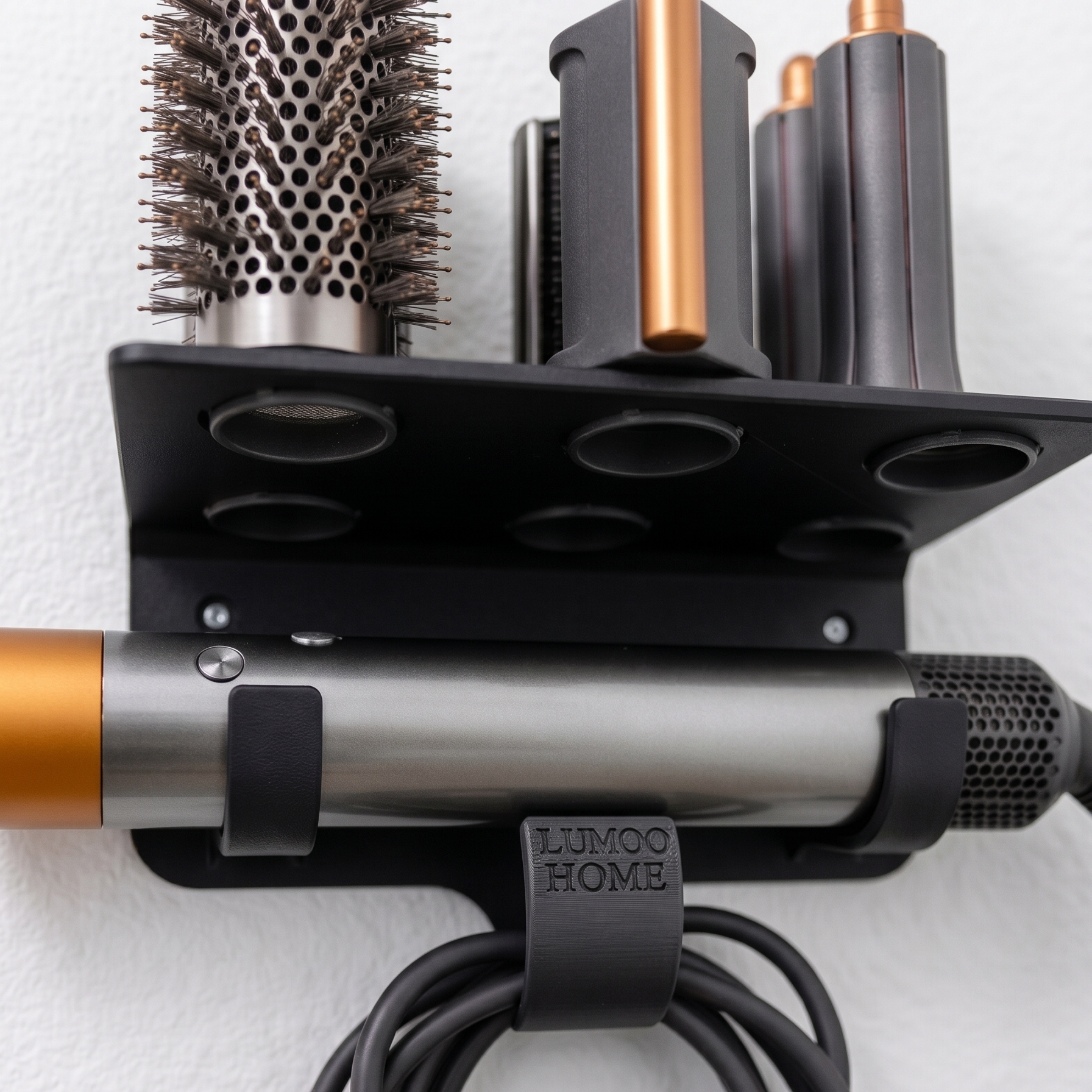 Wall-mounted Airwrap holder with appliance, attachments, and cable